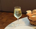 Glass of PoÃÂ¡ip wine with basket of bread